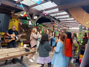 live music at pink apple glamping